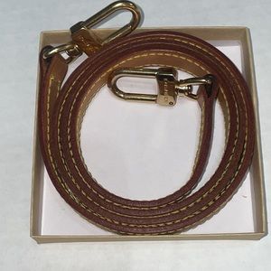 LIKE NEW. LOUIS VUITTON LEATHER STRAP. 2 BUCKLES BOTH STAMPED.  LEATHER STAMPED